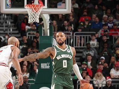 MILWAUKEE, WI - DECEMBER 11:  Damian Lillard #0 of the Milwaukee Bucks handles the ball during the game  on December 11, 2023 at the Fiserv Forum Center in Milwaukee, Wisconsin. NOTE TO USER: User expressly acknowledges and agrees that, by downloading and or using this Photograph, user is consenting to the terms and conditions of the Getty Images License Agreement. Mandatory Copyright Notice: Copyright 2023 NBAE (Photo by Gary Dineen/NBAE via Getty Images).