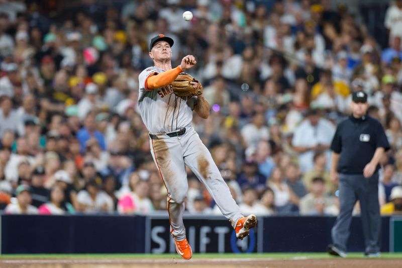 Sep 6, 2024; San Diego, California, USA; San Francisco Giants third basemen Matt Chapman (26) makes the throw to first for an out during the sixth inning against the San Diego Padres at Petco Park. Mandatory Credit: David Frerker-Imagn Images