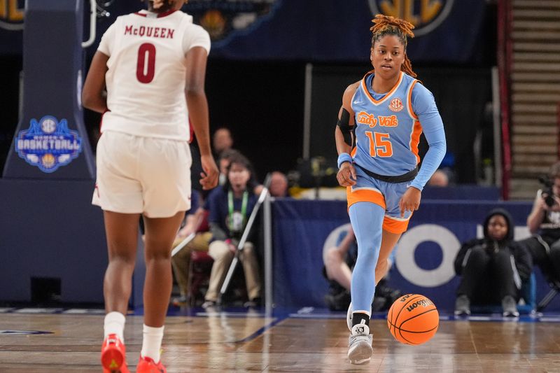 Mar 8, 2024; Greensville, SC, USA; Tennessee Lady Vols guard Jasmine Powell (15) brings the ball up court against Alabama Crimson Tide guard Loyal McQueen (0) during the second half at Bon Secours Wellness Arena. Mandatory Credit: Jim Dedmon-USA TODAY Sports