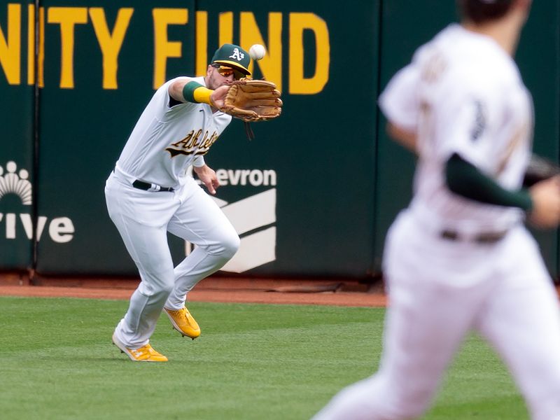 Sep 16, 2023; Oakland, California, USA; Oakland Athletics right fielder Seth Brown (15) makes the catch of a sacrifice fly by San Diego Padres left fielder Juan Soto (not pictured) during the first inning at Oakland-Alameda County Coliseum. Mandatory Credit: D. Ross Cameron-USA TODAY Sports
