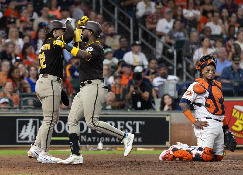 Sep 9, 2023; Houston, Texas, USA; San Diego Padres catcher Luis Campusano (12) celebrates first baseman Jurickson Profar (10) two run home run against the Houston Astros in the fourth inning at Minute Maid Park. Mandatory Credit: Thomas Shea-USA TODAY Sports