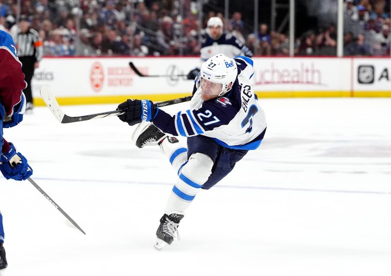 Apr 28, 2024; Denver, Colorado, USA; Winnipeg Jets left wing Nikolaj Ehlers (27) takes a shot on goal during the third period against the Colorado Avalanche in game four of the first round of the 2024 Stanley Cup Playoffs at Ball Arena. Mandatory Credit: Ron Chenoy-USA TODAY Sports