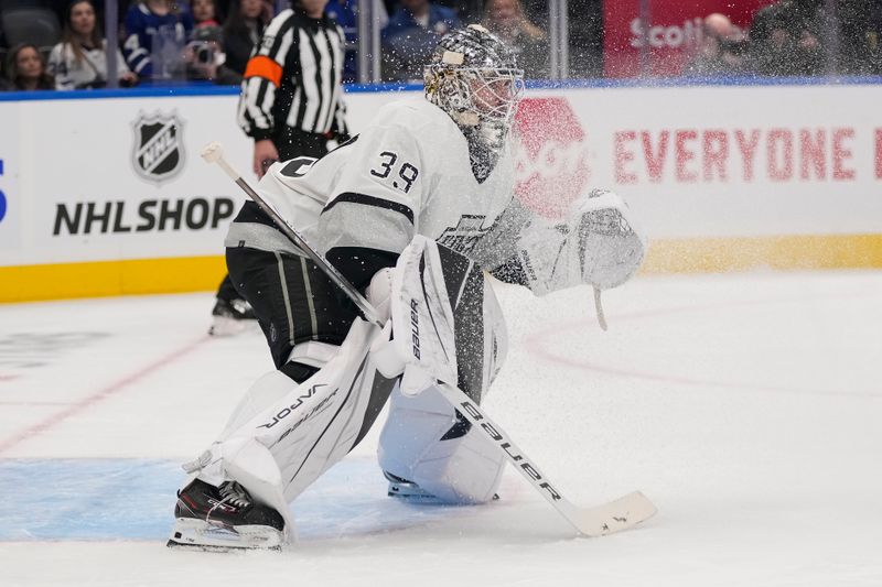 Oct 31, 2023; Toronto, Ontario, CAN; Los Angeles Kings goaltender Cam Talbot (39) looks for the puck through a spray of snow during the third period at Scotiabank Arena. Mandatory Credit: John E. Sokolowski-USA TODAY Sports