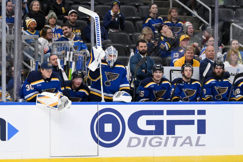 Oct 15, 2024; St. Louis, Missouri, USA; St. Louis Blues goaltender Jordan Binnington (50) looks on with teammates during the third period against the Minnesota Wild at Enterprise Center. Mandatory Credit: Jeff Le-Imagn Images