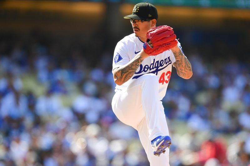 May 19, 2024; Los Angeles, California, USA; Los Angeles Dodgers pitcher Anthony Banda (43) throws against the Cincinnati Reds during the tenth inning at Dodger Stadium. Mandatory Credit: Gary A. Vasquez-USA TODAY Sports