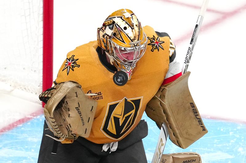 sJan 11, 2024; Las Vegas, Nevada, USA; Vegas Golden Knights goaltender Logan Thompson (36) takes a Boston Bruins shot to the front of his mask during the third period at T-Mobile Arena. Mandatory Credit: Stephen R. Sylvanie-USA TODAY Sports