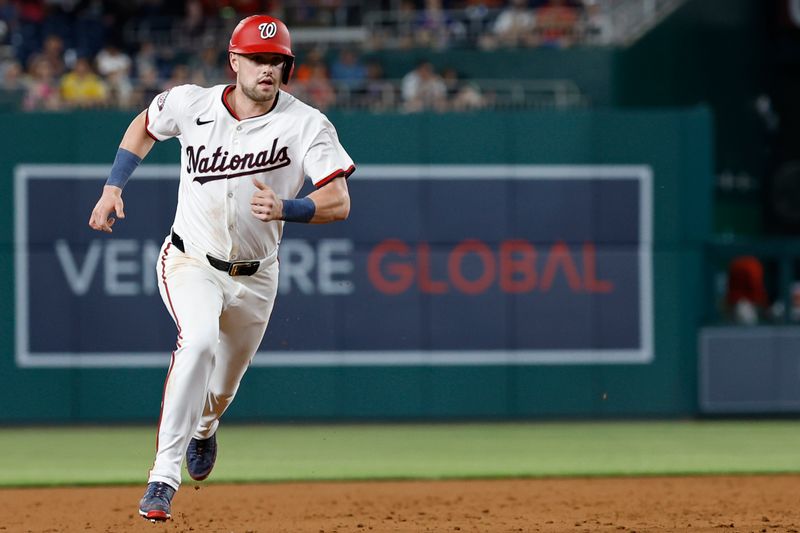 Jun 3, 2024; Washington, District of Columbia, USA; Washington Nationals outfielder Lane Thomas (28) advances to third base on a single by Nationals outfielder Eddie Rosario (not pictured) against the New York Mets during the sixth inning at Nationals Park. Mandatory Credit: Geoff Burke-USA TODAY Sports