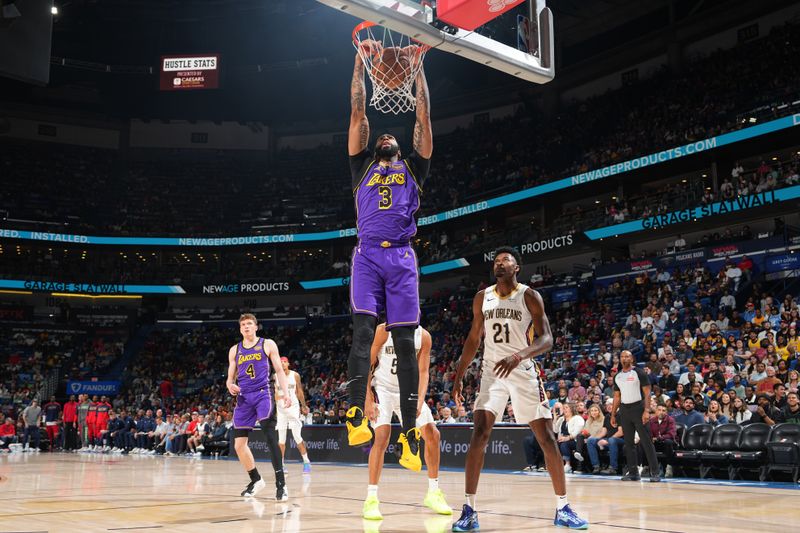 NEW ORLEANS, LA - NOVEMBER 16: Anthony Davis #3 of the Los Angeles Lakers dunks the ball during the game against the New Orleans Pelicans on November 16, 2024 at the Smoothie King Center in New Orleans, Louisiana. NOTE TO USER: User expressly acknowledges and agrees that, by downloading and or using this Photograph, user is consenting to the terms and conditions of the Getty Images License Agreement. Mandatory Copyright Notice: Copyright 2024 NBAE (Photo by Jesse D. Garrabrant/NBAE via Getty Images)