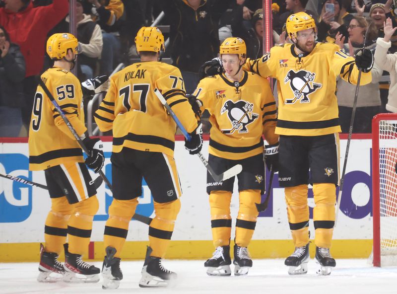 Jan 15, 2026; Pittsburgh, Pennsylvania, USA;  Pittsburgh Penguins right wing Egor Chinakhov (59) and defenseman Brett Kulak (77) and center Ben Kindel (81) congratulate right wing Justin Brazeau (16) on his power play goal against the Philadelphia Flyers during the first period at PPG Paints Arena. Mandatory Credit: Charles LeClaire-Imagn Images