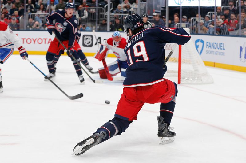 Nov 17, 2025; Columbus, Ohio, USA; Columbus Blue Jackets center Adam Fantilli (19) wrists a shot on goal against the Montreal Canadiens during the second period at Nationwide Arena. Mandatory Credit: Russell LaBounty-Imagn Images