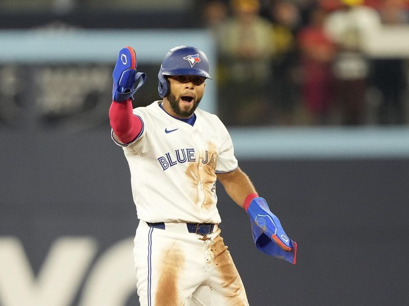 Jul 26, 2024; Toronto, Ontario, CAN; Toronto Blue Jays pinch runner Steward Berrora (37) reacts after stealing second base against the Texas Rangers during the ninth inning at Rogers Centre. Mandatory Credit: John E. Sokolowski-USA TODAY Sports