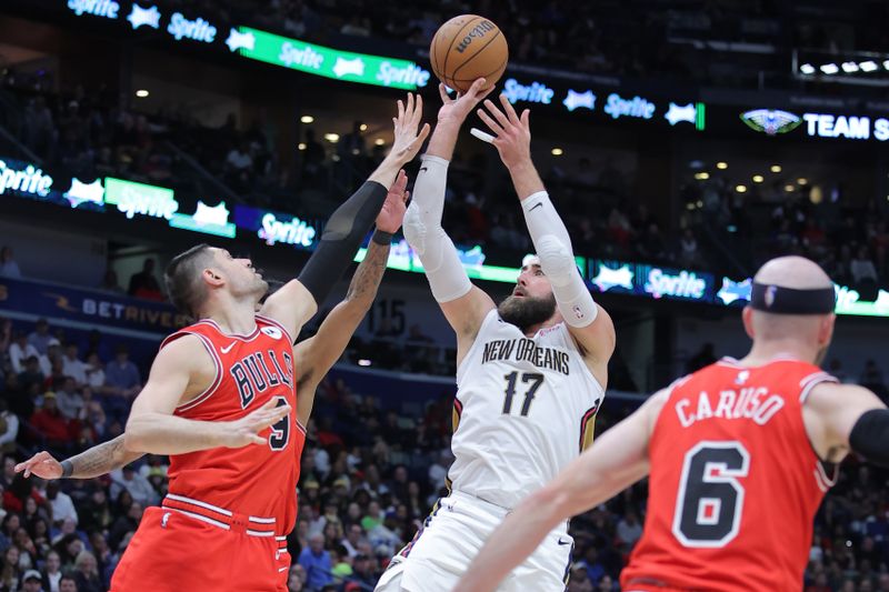 NEW ORLEANS, LOUISIANA - FEBRUARY 25: Jonas Valanciunas #17 of the New Orleans Pelicans shoots over Nikola Vucevic #9 of the Chicago Bulls during the second half at the Smoothie King Center on February 25, 2024 in New Orleans, Louisiana. NOTE TO USER: User expressly acknowledges and agrees that, by downloading and or using this Photograph, user is consenting to the terms and conditions of the Getty Images License Agreement. (Photo by Jonathan Bachman/Getty Images)