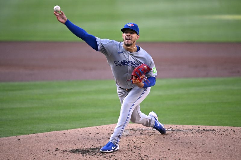 Apr 20, 2024; San Diego, California, USA; Toronto Blue Jays starting pitcher Jose Berrios (17) throws a pitch against the San Diego Padres during the first inning at Petco Park. Mandatory Credit: Orlando Ramirez-USA TODAY Sports