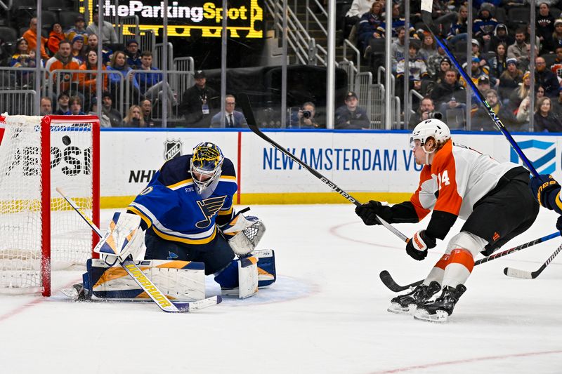 Jan 15, 2024; St. Louis, Missouri, USA;  Philadelphia Flyers right wing Owen Tippett (74) shoots and scores the game winning goal against St. Louis Blues goaltender Joel Hofer (30) during the third period at Enterprise Center. Mandatory Credit: Jeff Curry-USA TODAY Sports