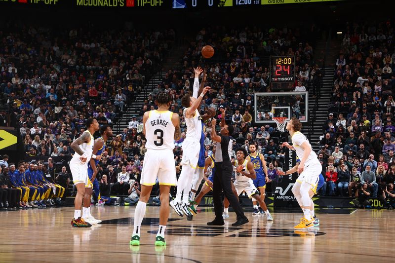 SALT LAKE CITY, UT - FEBRUARY 15: Walker Kessler #24 of the Utah Jazz and Draymond Green #23 of the Golden State Warriors go up for the opening tip off on February 15, 2024 at Delta Center in Salt Lake City, Utah. NOTE TO USER: User expressly acknowledges and agrees that, by downloading and or using this Photograph, User is consenting to the terms and conditions of the Getty Images License Agreement. Mandatory Copyright Notice: Copyright 2024 NBAE (Photo by Melissa Majchrzak/NBAE via Getty Images)