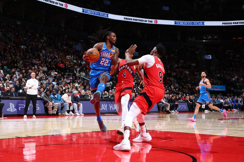 TORONTO, CANADA - DECEMBER 05: Cason Wallace #22 of the Oklahoma City Thunder looks to pass the ball during the game against the Toronto Raptors on December 5, 2024 at the Scotiabank Arena in Toronto, Ontario, Canada.  NOTE TO USER: User expressly acknowledges and agrees that, by downloading and or using this Photograph, user is consenting to the terms and conditions of the Getty Images License Agreement.  Mandatory Copyright Notice: Copyright 2024 NBAE (Photo by Vaughn Ridley/NBAE via Getty Images)