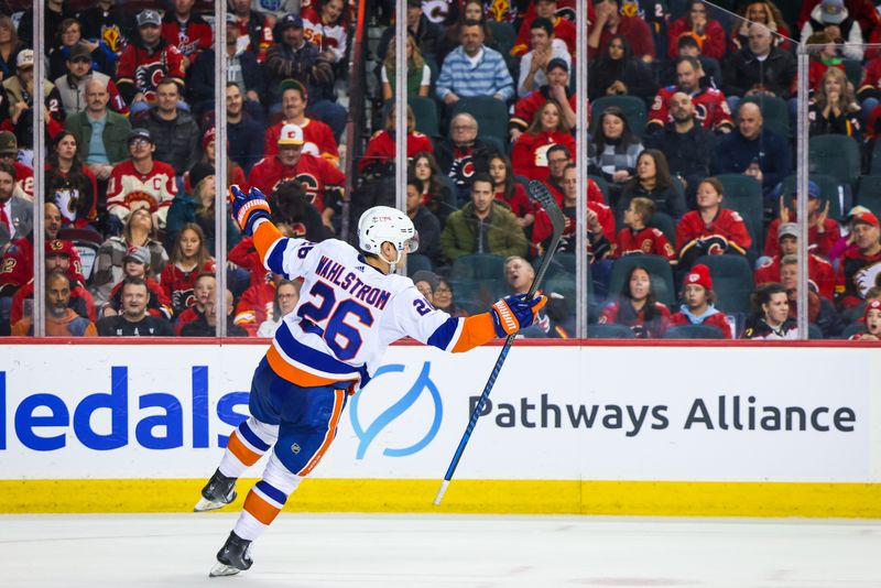 Nov 18, 2023; Calgary, Alberta, CAN; New York Islanders right wing Oliver Wahlstrom (26) celebrates his goal against the Calgary Flames during the shoot out period at Scotiabank Saddledome. Mandatory Credit: Sergei Belski-USA TODAY Sports