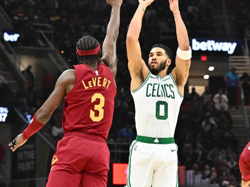 CLEVELAND, OHIO - DECEMBER 01: Jayson Tatum #0 of the Boston Celtics shoots over Caris LeVert #3 of the Cleveland Cavaliers during the first quarter at Rocket Mortgage Fieldhouse on December 01, 2024, in Cleveland, Ohio. NOTE TO USER: User expressly acknowledges and agrees that, by downloading and or using this photograph, User is consenting to the terms and conditions of the Getty Images License Agreement. (Photo by Jason Miller/Getty Images)