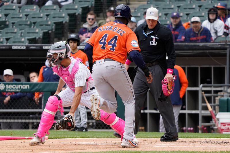 May 14, 2023; Chicago, Illinois, USA; Houston Astros left fielder Yordan Alvarez (44) scores as Chicago White Sox catcher Seby Zavala (44) waits for a throw during the first inning at Guaranteed Rate Field. Mandatory Credit: David Banks-USA TODAY Sports
