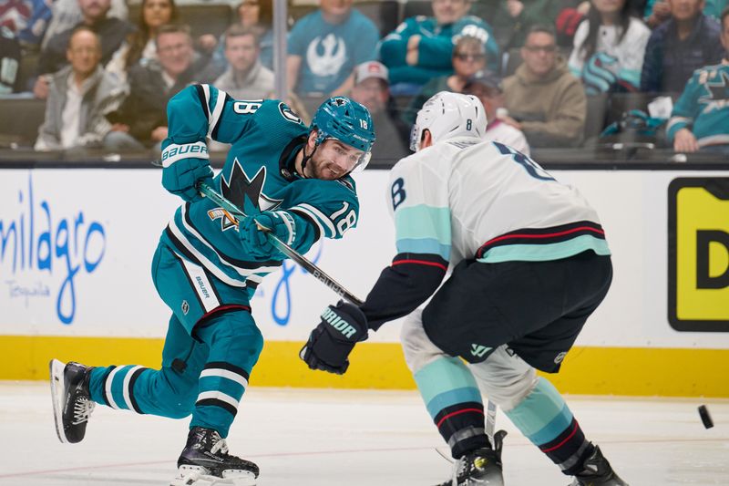 Jan 30, 2024; San Jose, California, USA; San Jose Sharks right wing Filip Zadina (18) shoots the puck against Seattle Kraken defenseman Brian Dumoulin (8) during the second period at SAP Center at San Jose. Mandatory Credit: Robert Edwards-USA TODAY Sports