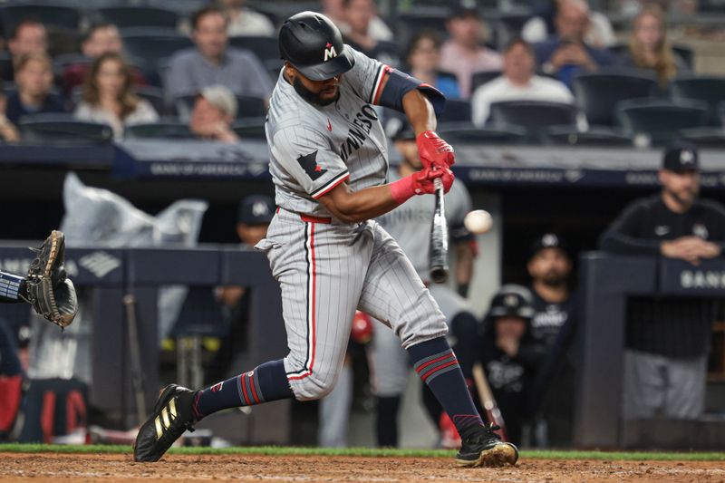 Jun 6, 2024; Bronx, New York, USA; Minnesota Twins right fielder Manuel Margot (13) singles during the eighth inning against the New York Yankees at Yankee Stadium. Mandatory Credit: Vincent Carchietta-USA TODAY Sports