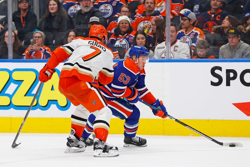 Jan 3, 2025; Edmonton, Alberta, CAN; Edmonton Oilers forward Jeff Skinner (53) carries the puck around Anaheim Ducks defensemen Radko Gudas (7) during the third period at Rogers Place. Mandatory Credit: Perry Nelson-Imagn Images