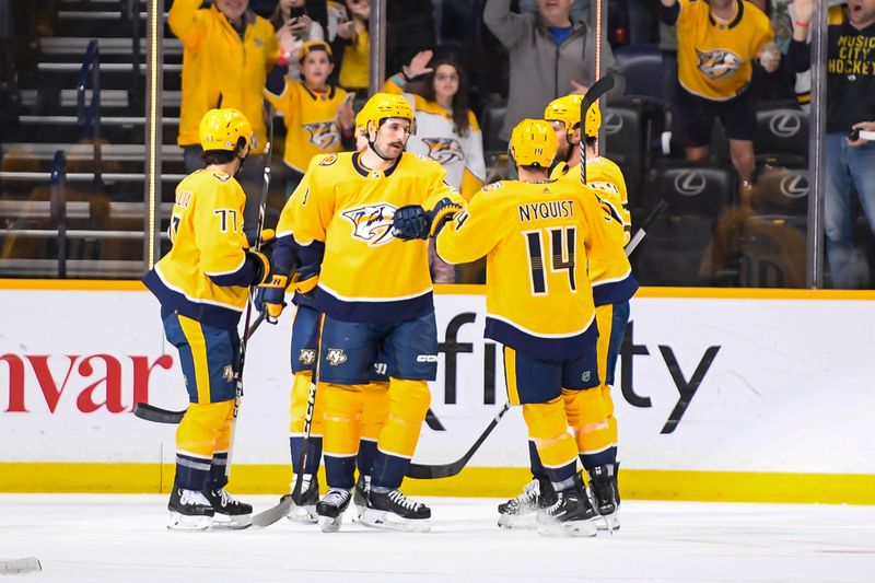  Apr 13, 2024; Nashville, Tennessee, USA; Nashville Predators left wing Filip Forsberg (9) celebrates his goal with his teammates against the Columbus Blue Jackets during the second period at Bridgestone Arena. Mandatory Credit: Steve Roberts-USA TODAY Sports