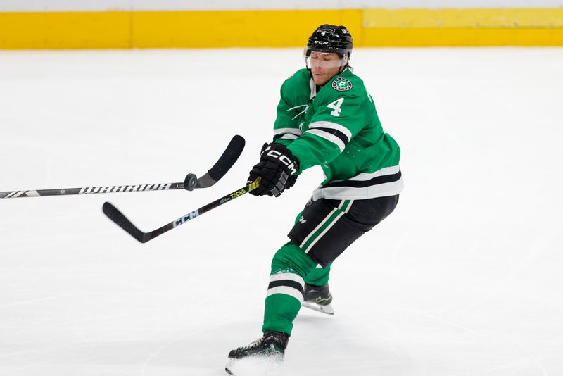 Mar 16, 2024; Dallas, Texas, USA; Dallas Stars defenseman Miro Heiskanen (4) tips a puck mid air during the third period against Los Angeles Kings at American Airlines Center. Mandatory Credit: Andrew Dieb-USA TODAY Sports