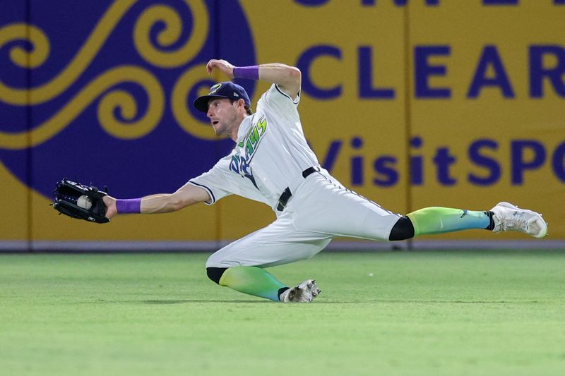 May 24, 2025; Tampa, Florida, USA; Tampa Bay Rays right fielder Josh Lowe (15) makes a diving catch against the Tampa Bay Rays in the eighth inning at George M. Steinbrenner Field. Mandatory Credit: Nathan Ray Seebeck-Imagn Images