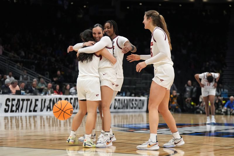 Mar 27, 2023; Seattle, WA, USA; Virginia Tech Hokies players celebrate on the court after defeating the Ohio State Buckeyes at Climate Pledge Arena. Mandatory Credit: Kirby Lee-USA TODAY Sports 