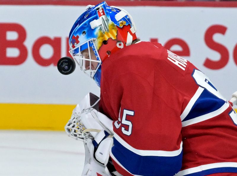 Sep 24, 2024; Montreal, Quebec, CAN; Montreal Canadiens goalie Connor Hughes (95) makes a save during the second period of the game against the New Jersey Devils at the Bell Centre. Mandatory Credit: Eric Bolte-Imagn Images