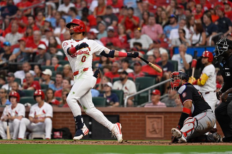 Jul 26, 2024; St. Louis, Missouri, USA; St. Louis Cardinals shortstop Masyn Winn (0) watches the ball after hitting a two-run home run against the Washington Nationals during the third inning at Busch Stadium. Mandatory Credit: Jeff Le-USA TODAY Sports