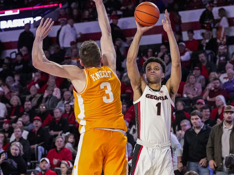 Jan 13, 2024; Athens, Georgia, USA; Georgia Bulldogs guard Jabri Abdur-Rahim (1) shoots over Tennessee Volunteers guard Dalton Knecht (3) during the second half at Stegeman Coliseum. Mandatory Credit: Dale Zanine-USA TODAY Sports