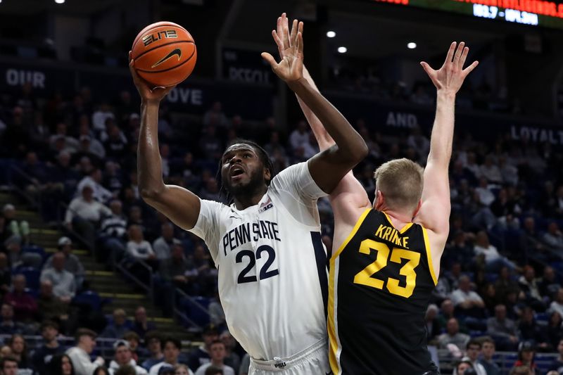 Feb 8, 2024; University Park, Pennsylvania, USA; Penn State Nittany Lions forward Qudus Wahab (22) shoots the ball as Iowa Hawkeyes forward Ben Krikke (23) defends during the first half at Bryce Jordan Center. Mandatory Credit: Matthew O'Haren-USA TODAY Sports