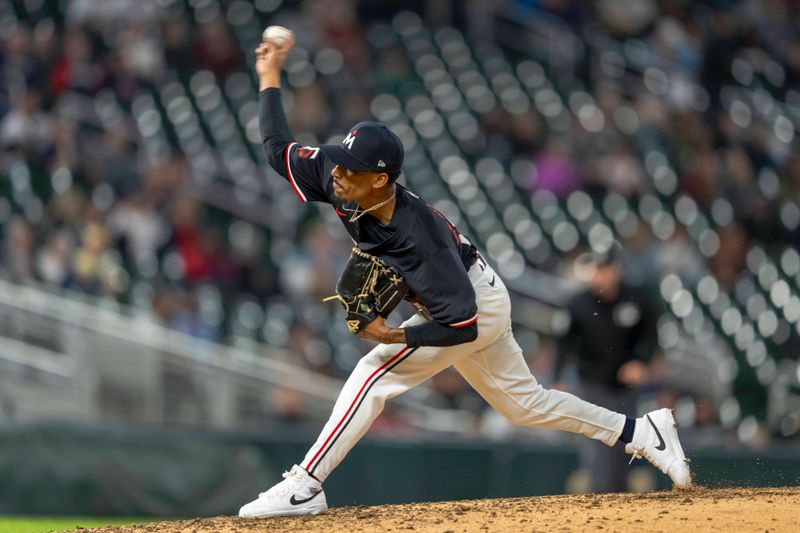 Apr 22, 2024; Minneapolis, Minnesota, USA; Minnesota Twins pitcher Ronny Henriquez (31) delivers a pitch against the Chicago White Sox in the ninth inning at Target Field. Mandatory Credit: Jesse Johnson-USA TODAY Sports