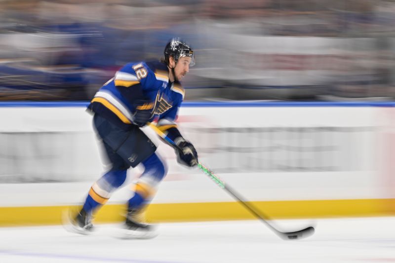 Nov 24, 2023; St. Louis, Missouri, USA;  St. Louis Blues right wing Kevin Hayes (12) controls the puck against the Nashville Predators during the first period at Enterprise Center. Mandatory Credit: Jeff Curry-USA TODAY Sports