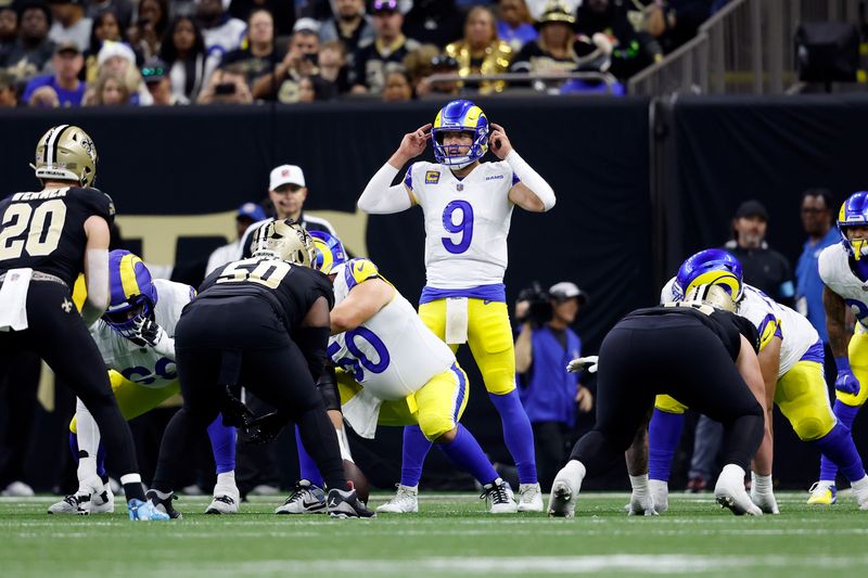 Los Angeles Rams quarterback Matthew Stafford (9) calls a play during an NFL football game against the New Orleans Saints, Sunday, Dec. 1, 2024, in New Orleans. (AP Photo/Tyler Kaufman)