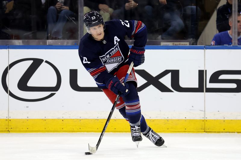 Dec 6, 2024; New York, New York, USA; New York Rangers defenseman Adam Fox (23) skates against the Pittsburgh Penguins during the third period at Madison Square Garden. Mandatory Credit: Brad Penner-Imagn Images