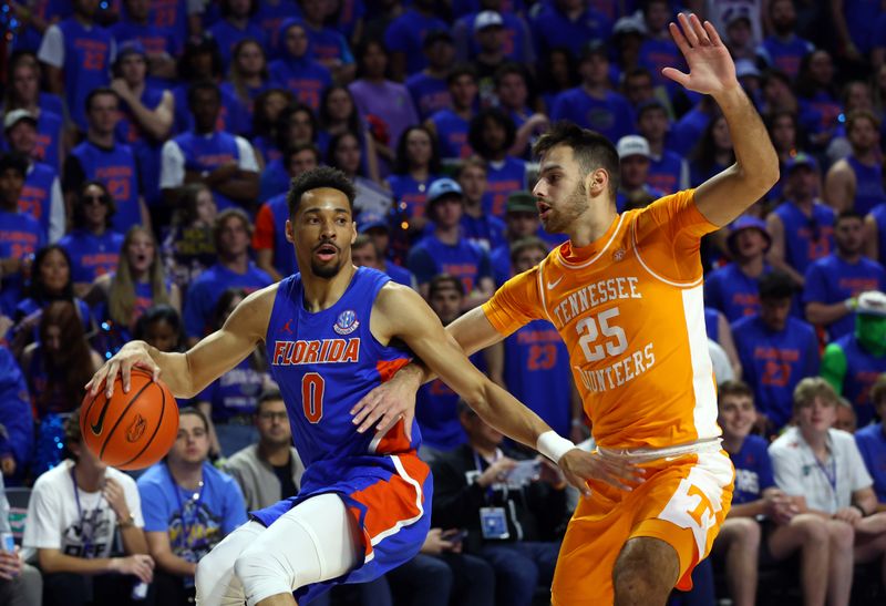 Feb 1, 2023; Gainesville, Florida, USA; Florida Gators guard Myreon Jones (0) dribbles against Tennessee Volunteers guard Santiago Vescovi (25) during the first half at Exactech Arena at the Stephen C. O'Connell Center. Mandatory Credit: Kim Klement-USA TODAY Sports