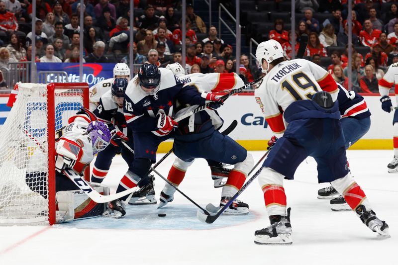 Nov 8, 2023; Washington, District of Columbia, USA; Washington Capitals defenseman Rasmus Sandin (38) and Florida Panthers defenseman Gustav Forsling (42) battle for the puck in front of Panthers goaltender Sergei Bobrovsky (72) in the third period at Capital One Arena. Mandatory Credit: Geoff Burke-USA TODAY Sports