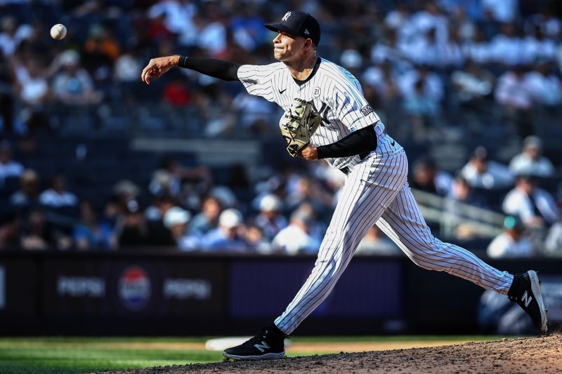 Sep 15, 2024; Bronx, New York, USA;  New York Yankees pitcher Jake Cousins (61) pitches in the ninth inning against the Boston Red Sox at Yankee Stadium. Mandatory Credit: Wendell Cruz-Imagn Images