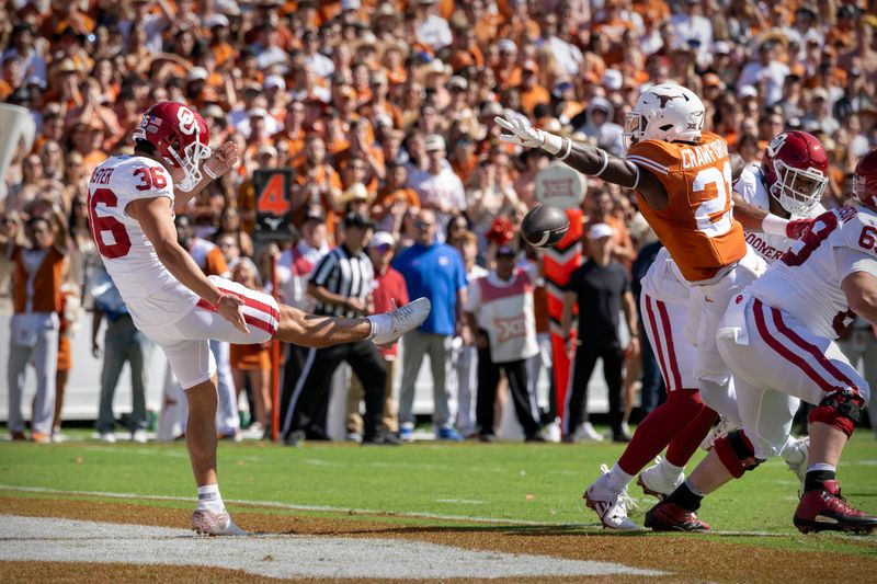 Oct 7, 2023; Dallas, Texas, USA; Texas Longhorns defensive back Kitan Crawford (21) blocks a punt by Oklahoma Sooners place kicker Josh Plaster (36) during the first half at the Cotton Bowl. Mandatory Credit: Jerome Miron-USA TODAY Sports