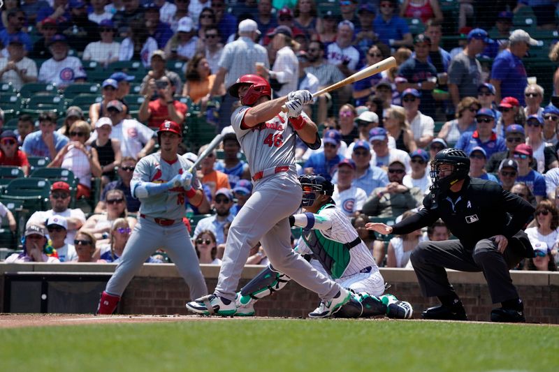 Jun 16, 2024; Chicago, Illinois, USA; St. Louis Cardinals first baseman Paul Goldschmidt (46) hits a single against the Chicago Cubs during the first inning at Wrigley Field. Mandatory Credit: David Banks-USA TODAY Sports