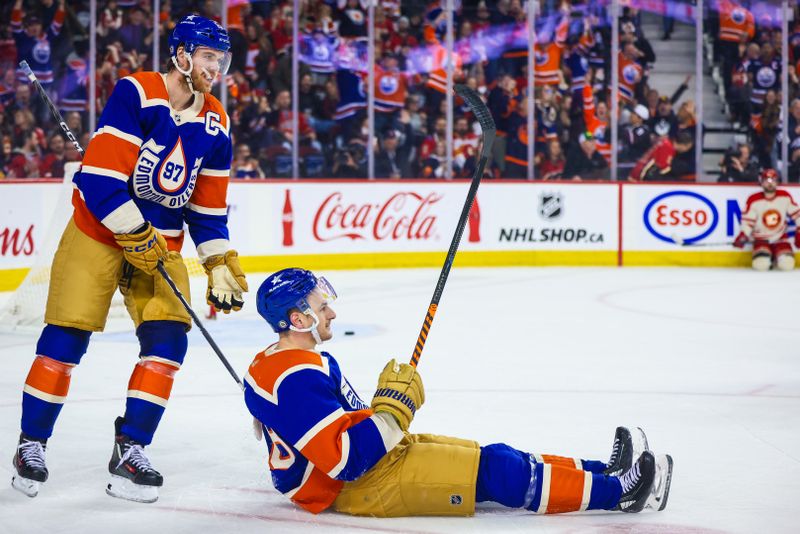Jan 20, 2024; Calgary, Alberta, CAN; Edmonton Oilers left wing Zach Hyman (18) celebrates his goal against the Calgary Flames during the third period at Scotiabank Saddledome. Mandatory Credit: Sergei Belski-USA TODAY Sports