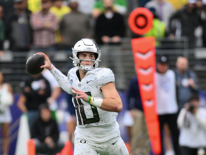 Oct 14, 2023; Seattle, Washington, USA; Oregon Ducks quarterback Bo Nix (10) passes the ball against the Washington Huskies during the second half at Alaska Airlines Field at Husky Stadium. Mandatory Credit: Steven Bisig-USA TODAY Sports