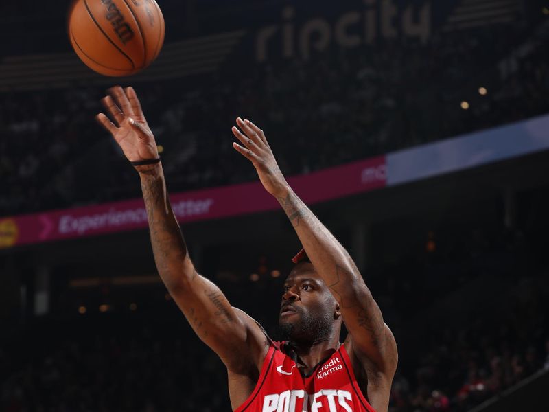 PORTLAND, OR - APRIL 12: Reggie Bullock Jr. #25 of the Houston Rockets shoots the ball during the game against the Portland Trail Blazers on April 12, 2024 at the Moda Center Arena in Portland, Oregon. NOTE TO USER: User expressly acknowledges and agrees that, by downloading and or using this photograph, user is consenting to the terms and conditions of the Getty Images License Agreement. Mandatory Copyright Notice: Copyright 2024 NBAE (Photo by Cameron Browne/NBAE via Getty Images)