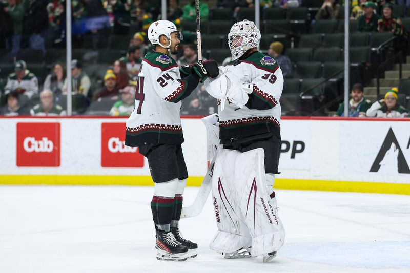 Jan 13, 2024; Saint Paul, Minnesota, USA; Arizona Coyotes defenseman Matt Dumba (24) congratulated goaltender Connor Ingram (39) after the win against the Minnesota Wild at Xcel Energy Center. Mandatory Credit: Matt Krohn-USA TODAY Sports