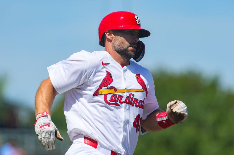 Mar 11, 2024; Jupiter, Florida, USA; St. Louis Cardinals first baseman Paul Goldschmidt (46) runs out a double against the Washington Nationals during the first inning at Roger Dean Chevrolet Stadium. Mandatory Credit: Sam Navarro-USA TODAY Sports