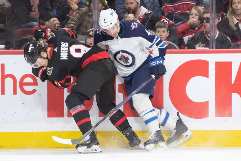 Jan 20, 2024; Ottawa, Ontario, CAN; Ottawa Senators center Josh Norris (9) battles with Winnipeg Jets defenseman Neal Pionk (4) in the first period at the Canadian Tire Centre. Mandatory Credit: Marc DesRosiers-USA TODAY Sports