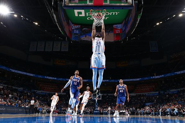 OKLAHOMA CITY, OK - NOVEMBER 25:  Kenrich Williams #34 of the Oklahoma City Thunder dunks the ball during the game against the Philadelphia 76ers on November 25, 2023 at Paycom Arena in Oklahoma City, Oklahoma. NOTE TO USER: User expressly acknowledges and agrees that, by downloading and or using this photograph, User is consenting to the terms and conditions of the Getty Images License Agreement. Mandatory Copyright Notice: Copyright 2023 NBAE (Photo by Zach Beeker/NBAE via Getty Images)